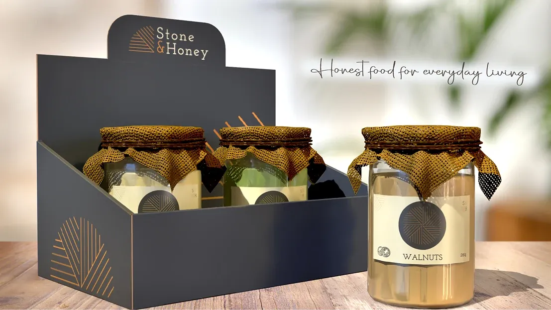 Stone & Honey jar packaging displayed in a branded countertop box